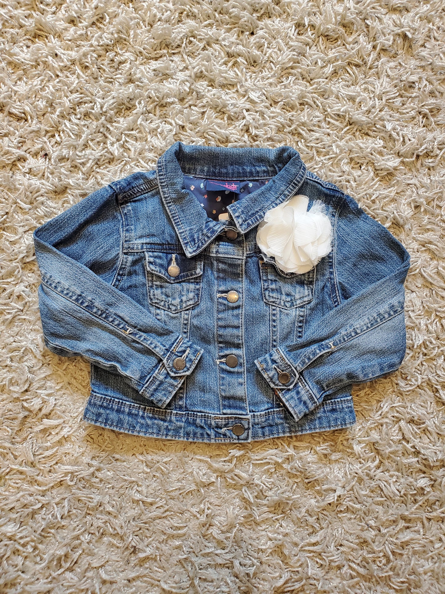 Oshkosh distressed denim jacket. Cute flower embellishment.  Size 4T. Excellent used condition.