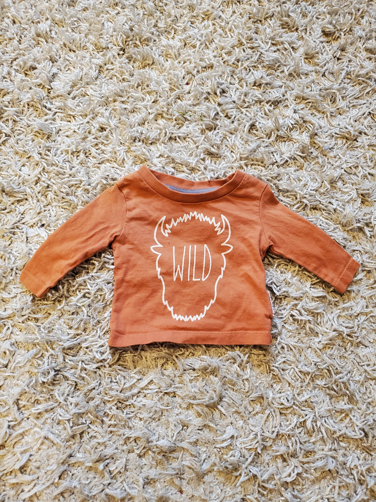 6-Sticks long sleeve t-shirt.  Good used condition. Some pilling and wash wear. Size newborn.